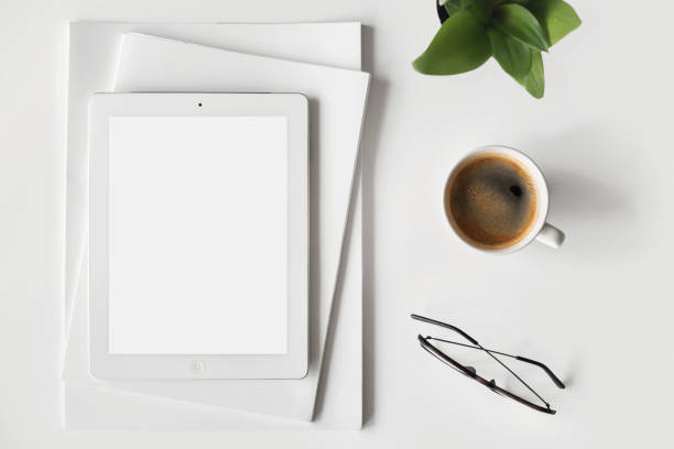 istock Digital tablet with blank empty screen mock up at home desk 1370473088