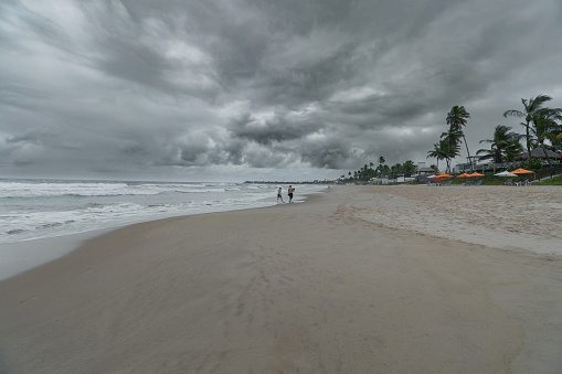 Beach day with rain forecast, heavy clouds and bad weather. Photo at Porto de Galinhas beach.