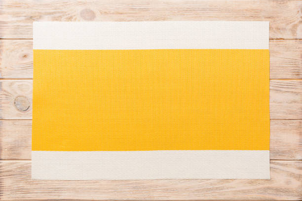 top view of yellow tablecloth for food on wooden background. empty space for your design. - tatami mat bildbanksfoton och bilder