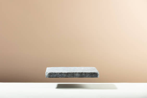 istock Flying Stone podium for packaging and cosmetic presentation. Monochrome beige template for mockup 1370477334