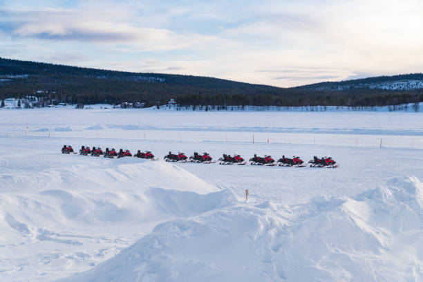 istock row of snow scooters 1370477808