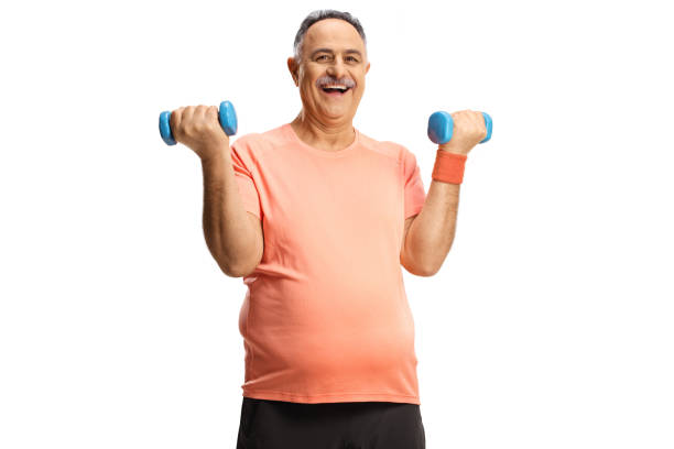 istock Happy mature man exercising with dumbbells and smiling 1370477821