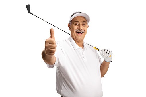 Mature man smiling, holding a golf club and gesturing thumbs up isolated on white background