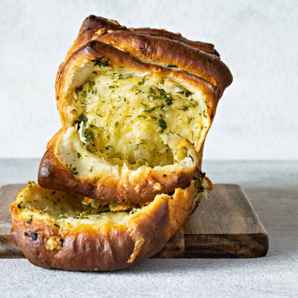 istock Homemade fresh  pull apart bread with herbs (parsley, thyme, rosemary, dill), garlic, cheese and spicy butter 1370479041