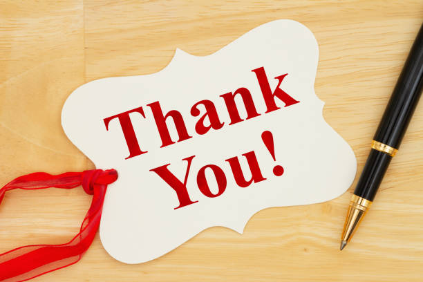 istock Thank you note for a present message on a gift tag with a pen 1370480639