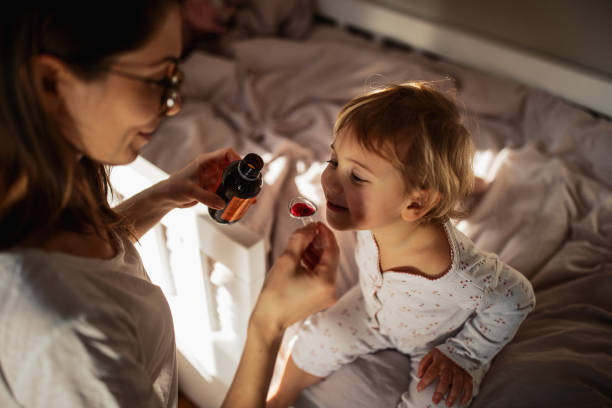 istock Mother taking care of sick child 1370480923