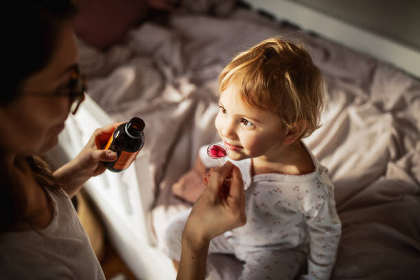 istock Mother taking care of sick child 1370481096