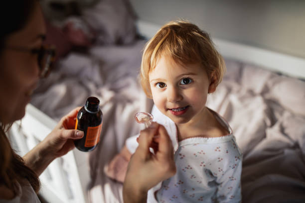 istock Mother taking care of sick child 1370481275