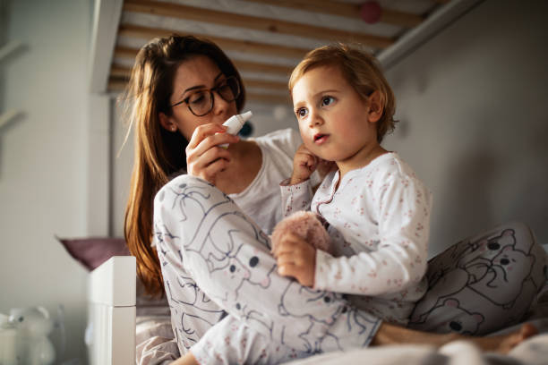 istock Mother taking care of sick child 1370482049
