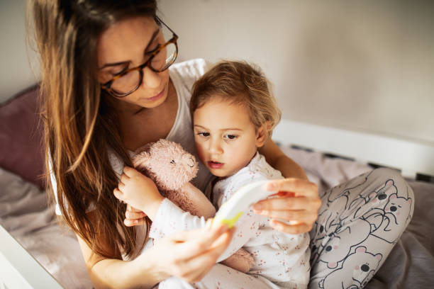 istock Mother taking care of sick child 1370482511