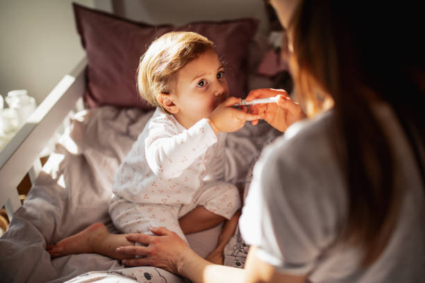 istock Mother taking care of sick child 1370482534
