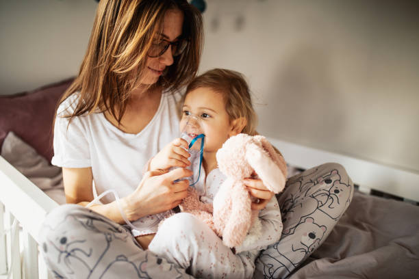istock Mother taking care of sick child 1370482631