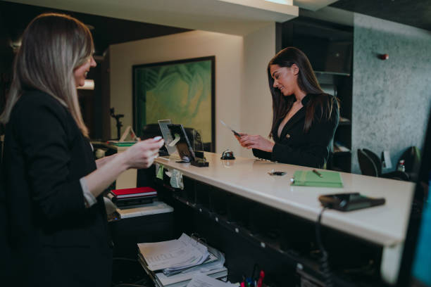 istock Businesswoman getting information at the hotel reception 1370484535
