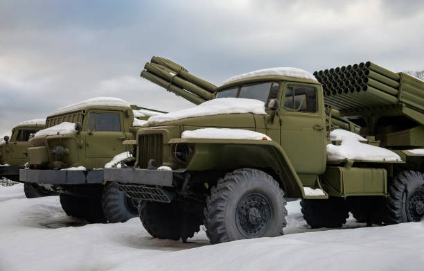 Modern types of multiple rocket launchers in the parking lot after  snowfall. Modern types of multiple rocket launchers in the parking lot after  snowfall. Different power and range options for multiple rocket launchers in the winter parking lot. artillery stock pictures, royalty-free photos & images