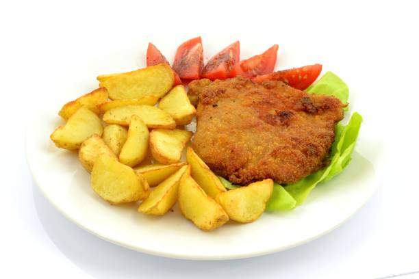 istock pork chop and baked potatoes 1370485791