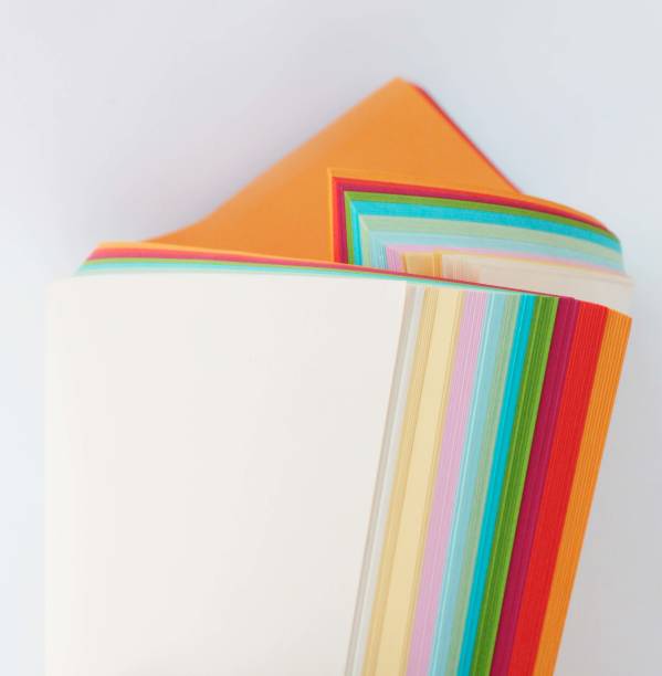istock unusual composition of colored paper, abstraction, bright colors on a white  multi colored paper 1370486090