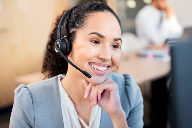 istock Shot of a young call centre agent working on a computer in an office 1370487249