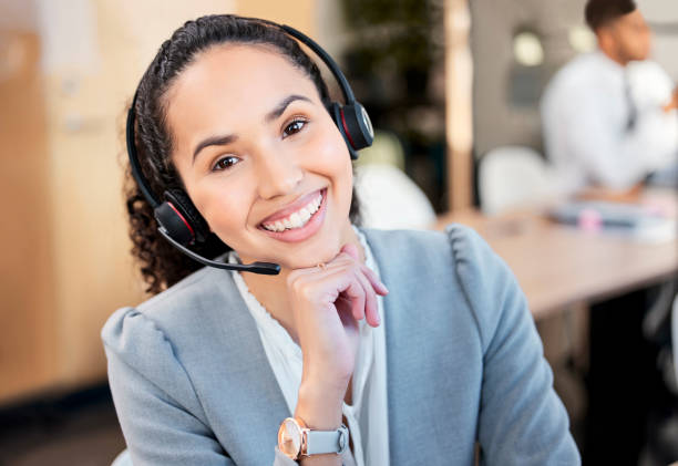 istock Portrait of a young call centre agent working in an office 1370487250