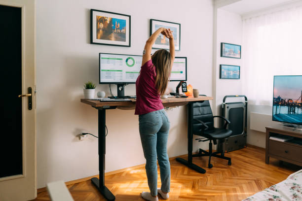istock Young woman with diabetes working at standing desk 1370488530