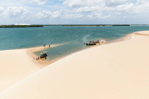 istock Boats moored on tranquil water protected by a high sand dunes 1370489818