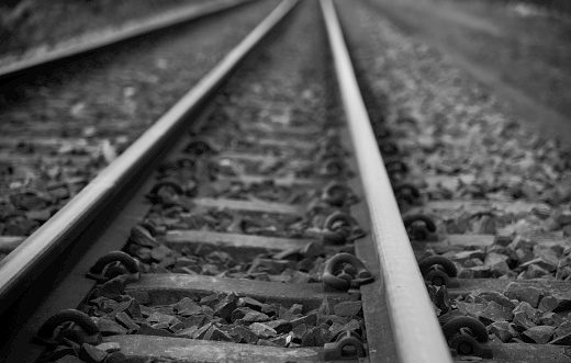 Traditional railway tracks dark black and white photo