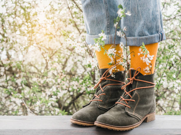 istock Trendy boots and colorful socks. Day light 1370492065