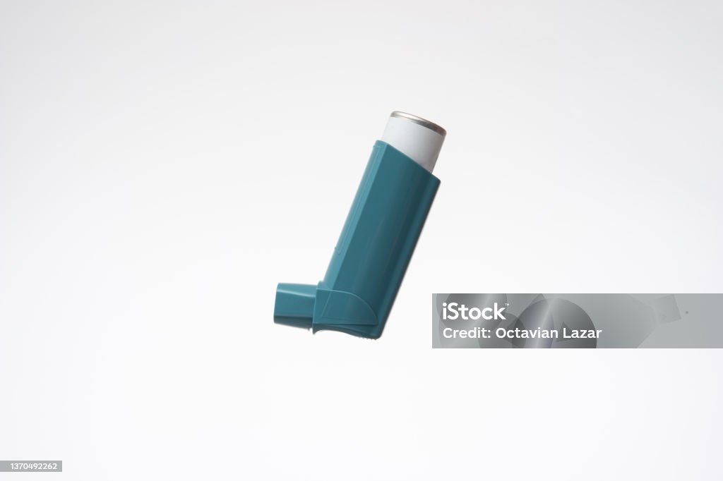 Asthma inhaler, generic, non-branded. Close up studio shot, isolated on white background Asthma Inhaler Stock Photo