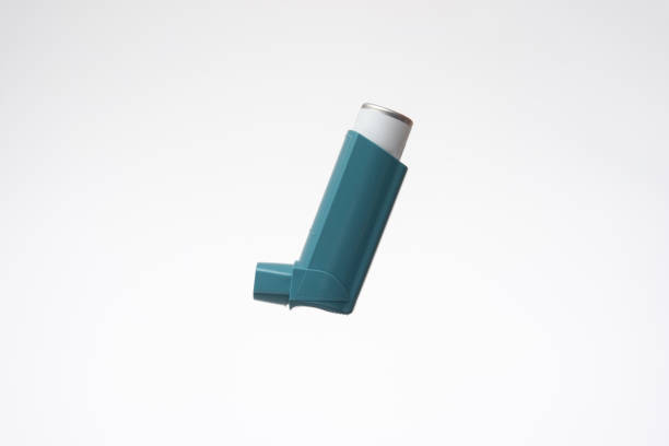 Asthma inhaler, generic, non-branded. Close up studio shot, isolated on white background stock photo