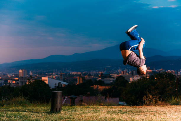 istock Young Caucasian man performs parkour jumping 1370493819