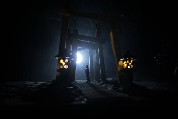 istock Creative artwork decoration. Abstract Japanese style wooden tunnel at night. Selective focus 1370494074