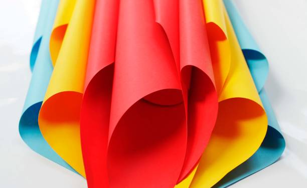 istock unusual composition of colored paper, abstraction, bright colors on a white  multi colored paper 1370494220