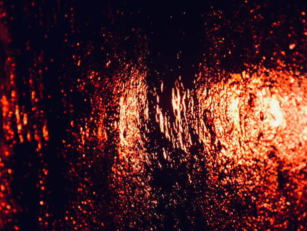 istock Red brake lights reflection on the street 1370494940