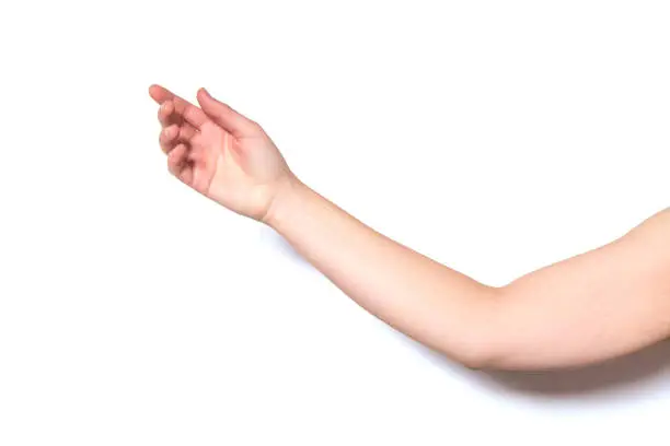 Arm of a woman with the palm of the hand open on a white background.
