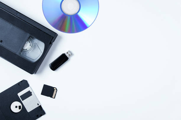 istock Video cassette, flash drive, memory card, CD, floppy disk. White background. Place text. 1370497508