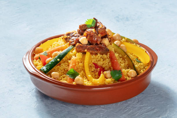Meat and vegetable couscous in a bowl, typical food from Morocco Meat and vegetable couscous in a bowl, typical food from Morocco, a traditional festive Arabic dish with herbs and spices couscous stock pictures, royalty-free photos & images