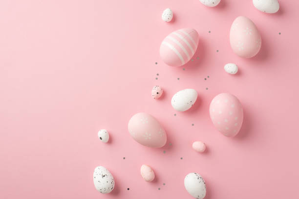 istock Top view photo of easter decorations sequins pink and white easter eggs on isolated pastel pink background with copyspace 1370502491