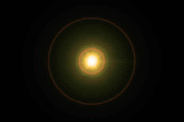 istock Easy to add lens flare effects for overlay designs or screen blending mode to make high-quality images. Abstract sun burst, digital flare, iridescent glare over black background. 1370502957