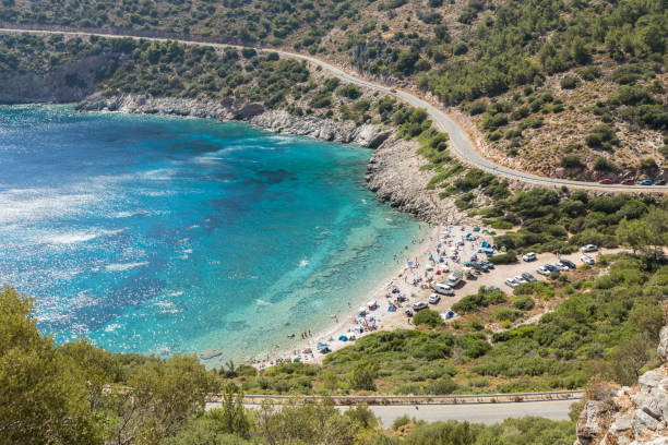 people camping and vacationing by the sea