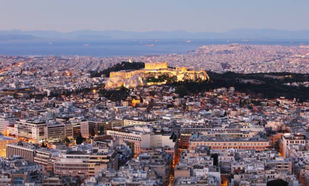 istock Greece - Athens skyline at night with acropolis 1370505899