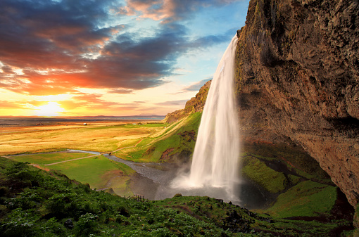 Seljalandsfoss is one of the most beautiful waterfalls on the Iceland. It is located on the South of the island. With a rainbow.