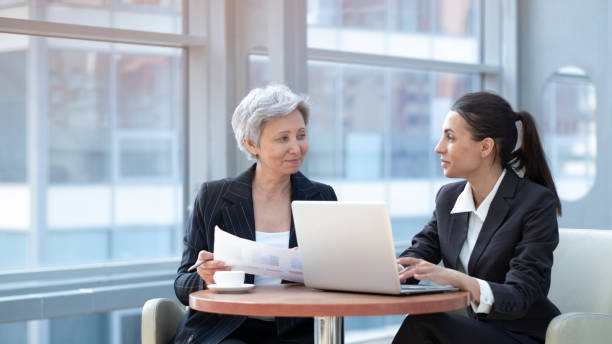 istock Two women working with laptop 1370506029