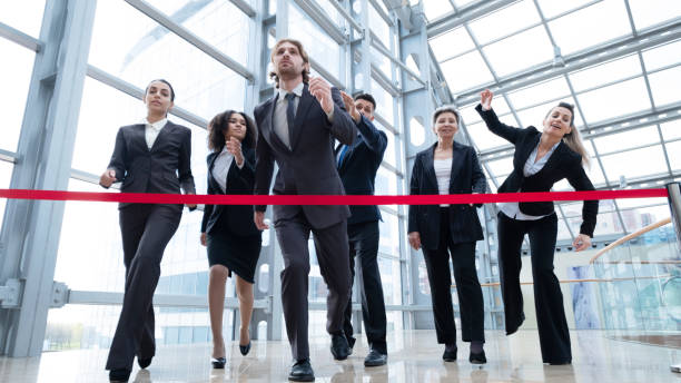istock Businesspeople crossing the finish line 1370506035