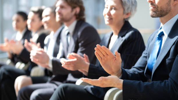 istock People applauding at business conference 1370506044