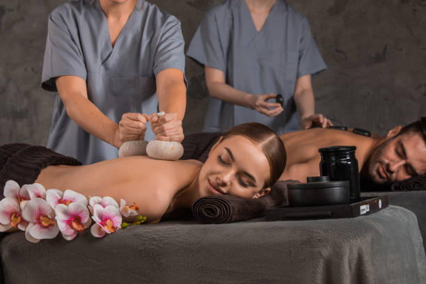 istock Beautiful couple enjoying massage 1370507236