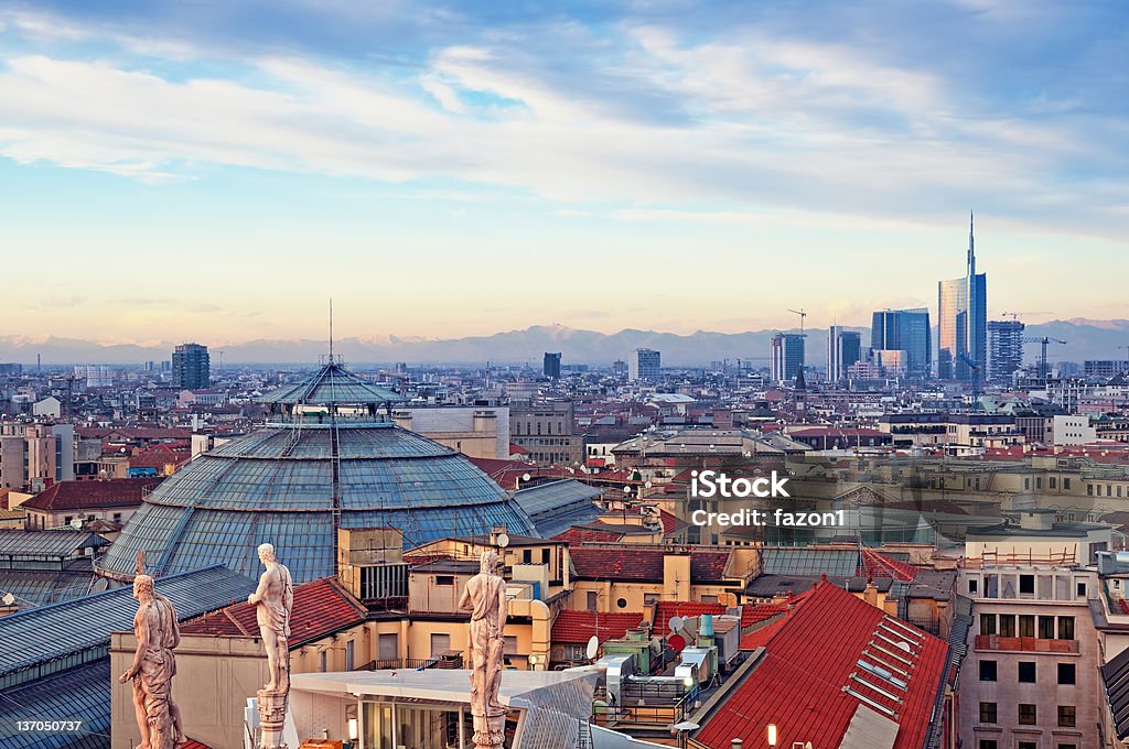 Milan skyline viewed from Duomo di Milan in Italy View of Milan from the rooftop of  “Duomo di Milano”. Statues of  Duomo of Milan, Galleria Vittorio Emanuele II and skycrapert of Porta Nouva also visible. Milan Stock Photo