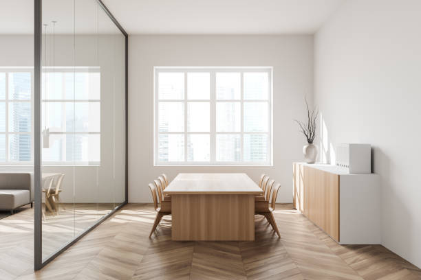 istock Light meeting interior with seats, table and commode near panoramic window 1370511004