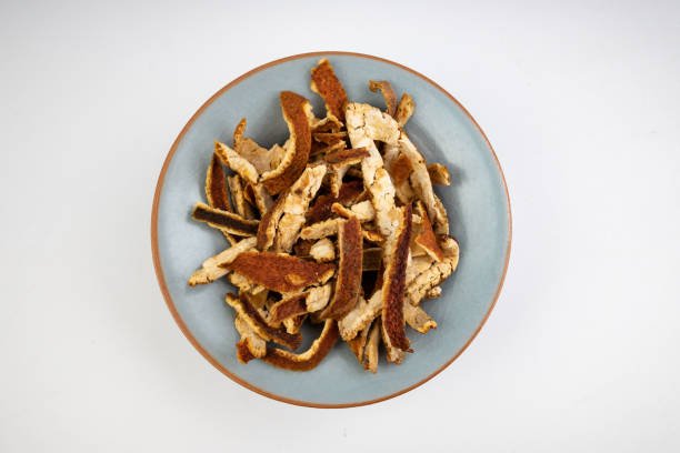 Dried Tangerine Peel on white background.  Cooking spice.