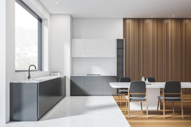istock Modern cooking set interior with sink, dining table and chairs, window 1370512620
