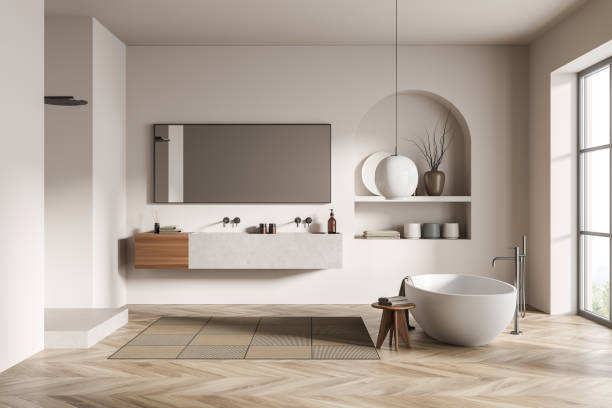 istock Modern bathroom interior with ceramic bathtub, double sink, mirror, shower. White walls, hardwood flooring. Panoramic window. 3d rendering. 1370512749