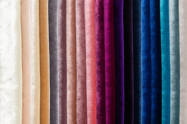 istock Tissue catalog. Catalog of multi-colored fabric samples. Textile industry background. Colored cotton fabric. 1370512759